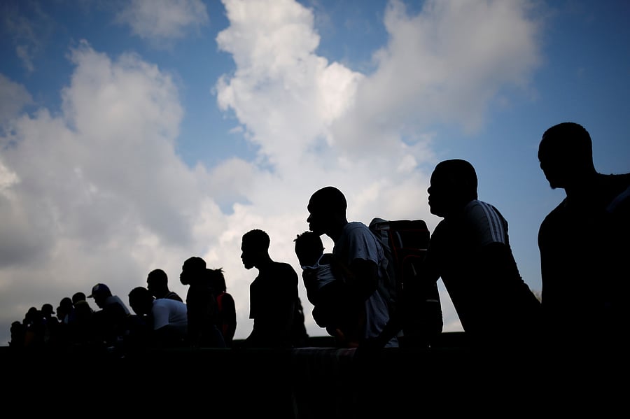Migrants wait to get on buses after accepting an offer from the Mexican government to obtain humanitarian visas to transit Mexican territory. Credit: Reuters Photo
