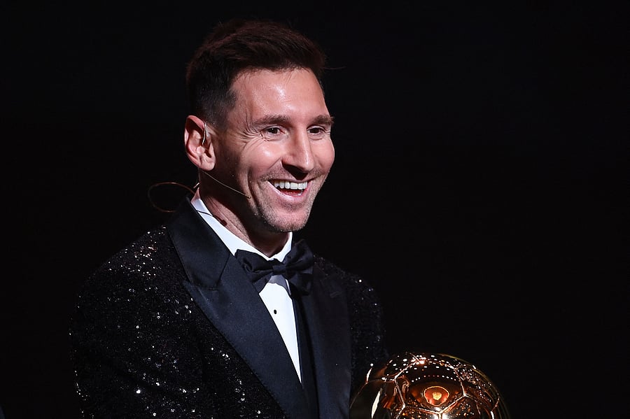 Paris Saint-Germain's Argentine forward Lionel Messi poses after being awarded the the Ballon d'Or award during the 2021 Ballon d'Or France Football award ceremony at the Theatre du Chatelet in Paris. Credit: AFP Photo