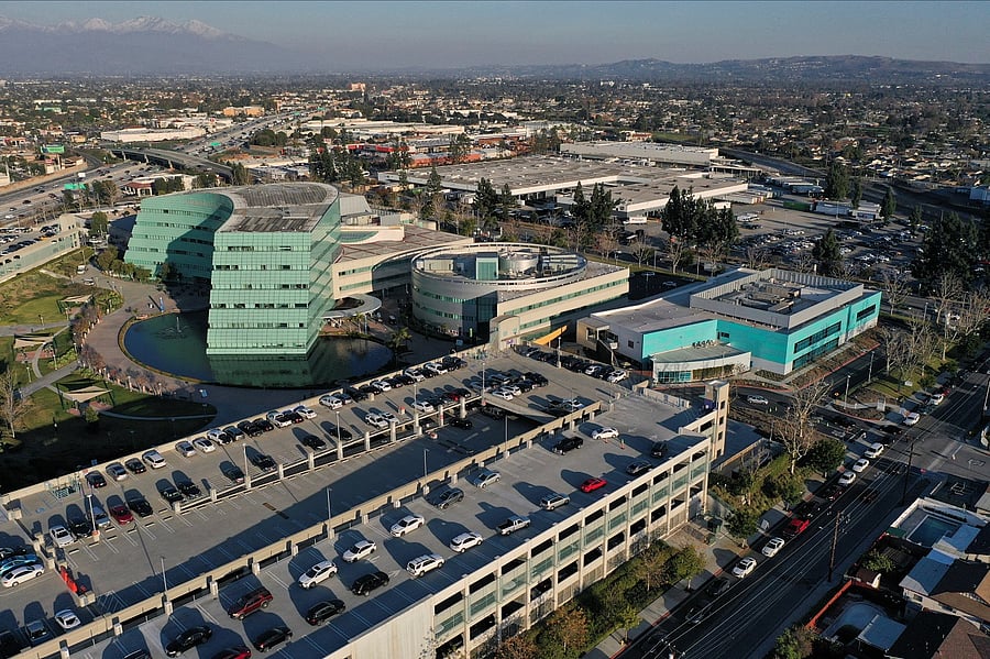 People queue in their cars at a coronavirus disease (Covid-19) drive-thru testing site on top of a parking garage at Kaiser Permanente Baldwin Park Medical Center. Credit: Reuters Photo