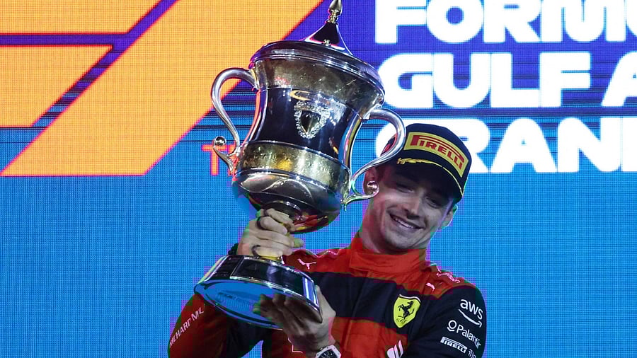 Ferrari's Monegasque driver Charles Leclerc celebrates on the podium winning the Bahrain Formula One Grand Prix at the Bahrain International Circuit in the city of Sakhir. Credit: AFP Photo