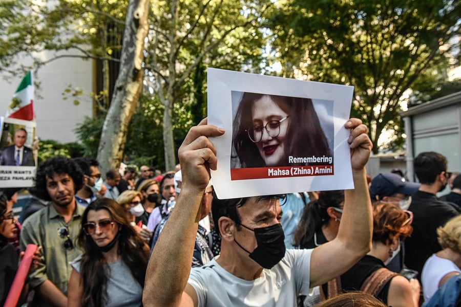 People participate in a protest against Iranian President Ebrahim Raisi outside of the United Nations in New York City. Protests have broke out over the death of 22-year-old Iranian woman Mahsa Amini, who died in police custody for allegedly violating the country's hijab rules. Amini's death has sparked protests across Iran and other countries. Credit: AFP Photo