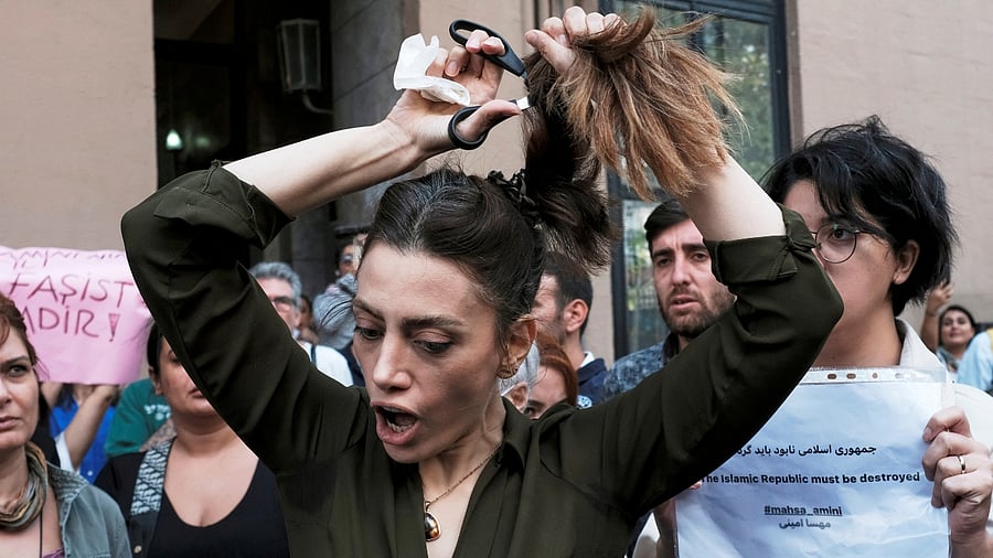 Mahsa Amini's death: Women protest by cutting their hair, burning hijabs