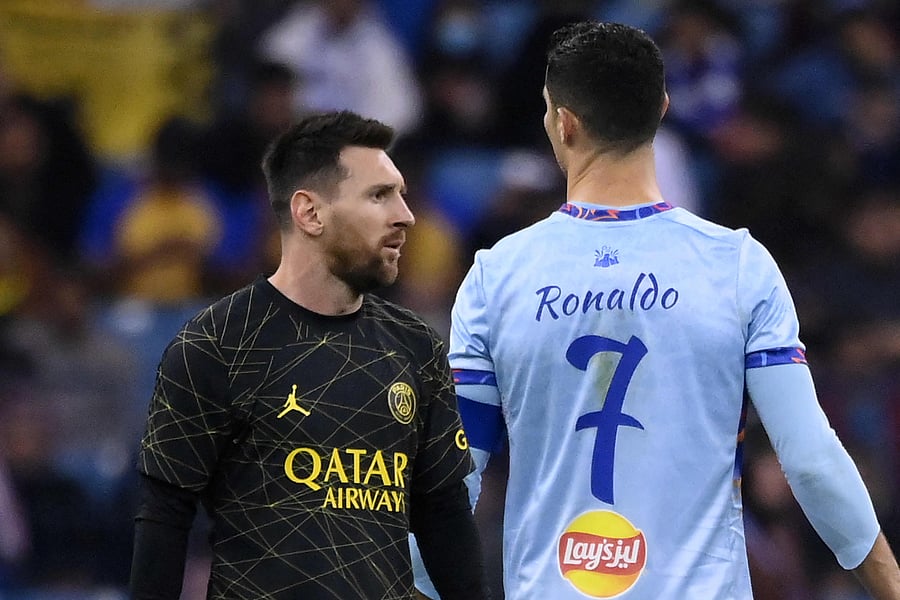 Paris Saint-Germain's Argentine forward Lionel Messi (L) walks past Riyadh All-Star's Portuguese forward Cristiano Ronaldo (R) during the Riyadh Season Cup football match between the Riyadh All-Stars and Paris Saint-Germain at the King Fahd Stadium in Riyadh. Credit: AFP Photo