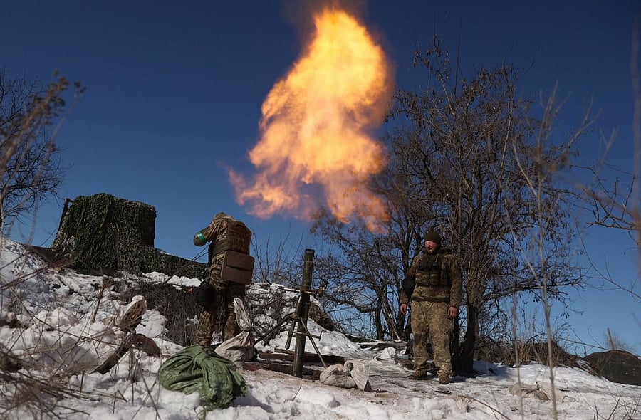 Ukrainian servicemen fire a mortar toward the Russian position on a frontline not far from Bakhmut in Donetsk region. Credit: Reuters Photo