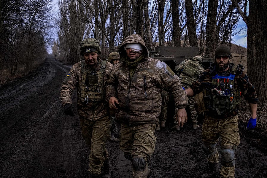 Ukrainian combat medics evacuate a wounded Ukrainian serviceman from the front line near Bakhmut. Credit: AFP Photo