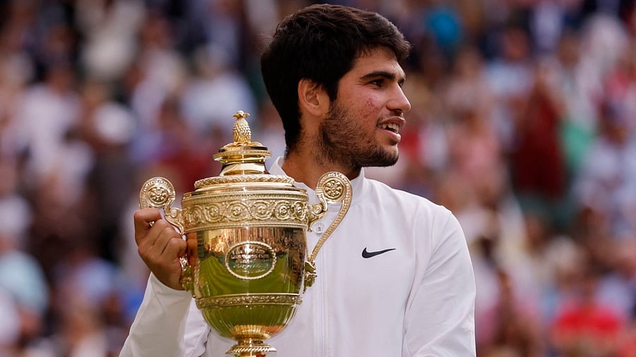 Spain's Carlos Alcaraz celebrates with the trophy after winning his final match against Serbia's Novak Djokovic. Credit: Reuters Photo