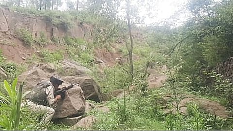 Alt="Security officer during a search operation in Udhampur"