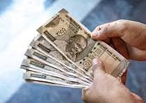 Rupee down to 90.64 a dollar, delay in US deal major villain