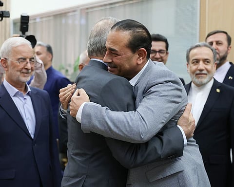 Iranian president Masoud Pezeshkian (left) embraces Pakistan's army chief, Asim Munir, in Tehran on 23 May. 