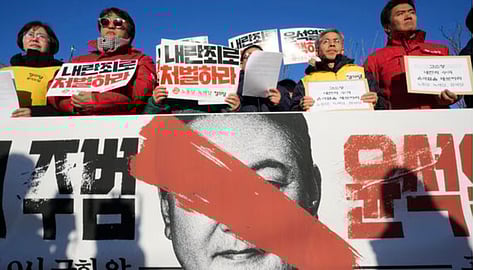Protesters stage a rally to demand South Korean President Yoon Suk Yeol to step down, in Seoul on Wednesday.
