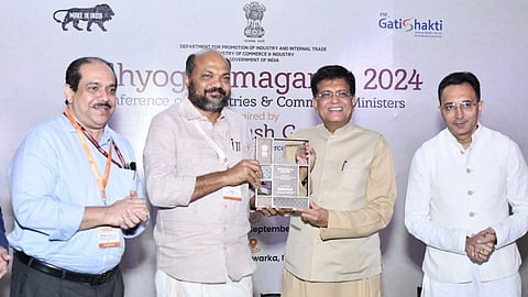 Kerala Minister P. Rajeev received the Business Reforms Action Plan ’22 (BRAP 22) award from Union Minister of Commerce Piyush Goyal  (Pic: Minister P Rajeev Facebook handle)