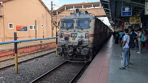 Indian train arriving at railway station. Indian railways
