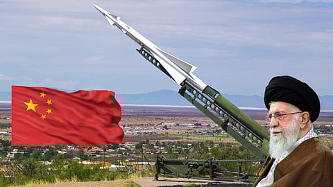 A digitally edited image showing a large missile launcher in the foreground, with a Chinese flag waving to the left and a Middle Eastern religious leader in traditional attire (possibly intended to represent Iran) on the right. The background shows a desert landscape with a town and mountains.
