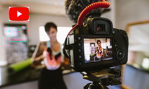 A girl making video for youtube, youtube emblem