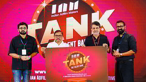 Indian Adfilm Makers Association launching TANK – The Talent Bank initiative, with four representatives holding the event banner on stage