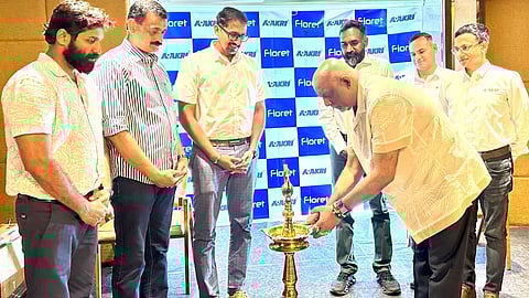 Group of officials at a Floret and Akari event, with a traditional lamp-lighting ceremony marking the inauguration.