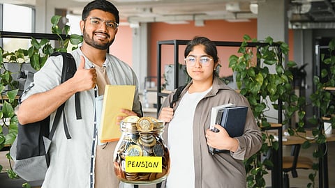 Two young professionals holding books and backpacks stand beside a glass jar filled with coins labelled “Pension,” symbolising financial planning and saving for the future