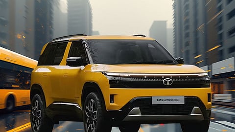Yellow Tata Sierra SUV showcased on a city street, highlighting Tata Motors’ modern design and bold styling.