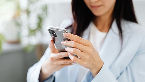 lady looking at mobile phone