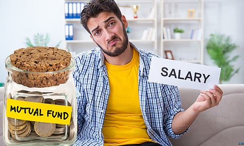 man frustrated at bills he needs to pay