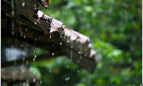 Rain drops falling from old building
