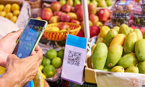 Customer making digital payment at local grocery store