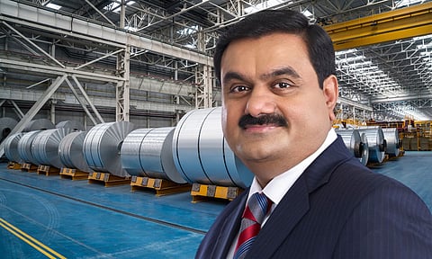 Gautam adani in the back=drop of aluminium factory