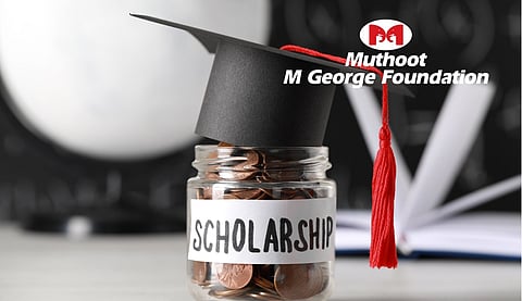 Scholarship Concept. Glass Jar with Coins and Graduation Cap on and muthoot m gerorge foundation logo