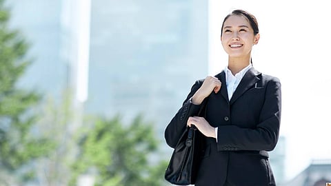 Confident Businesswoman Smiling in Professional Attire