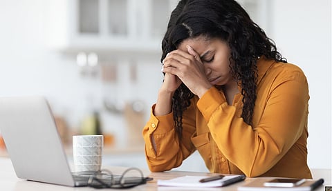 Tired  lady experiencing burnout, working online