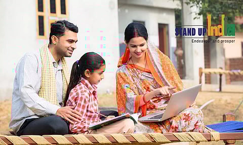 Family looking at laptop