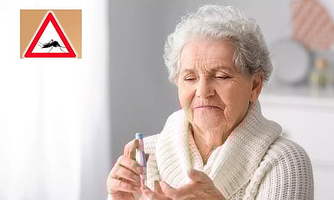 Old woman checking sugar level