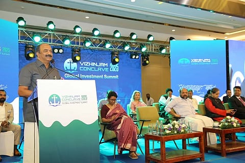Minister K.N. Balagopal inaugurated the Vizhinjam Conclave 2025. Notable dignitaries on stage included Chief Secretary Sharada Muraleedharan, Minister P. Rajeeve, and Member of Parliament Shashi Tharoor