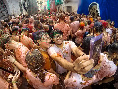 Why does Buñol hold a festival where everyone becomes tomato-red?