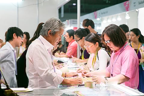 Buyers at booths.