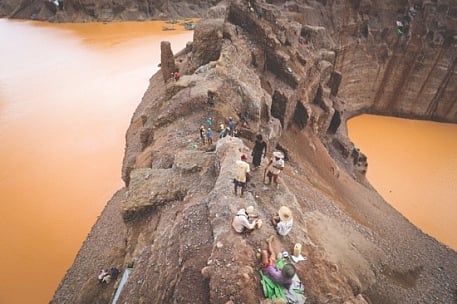 Freelance jade miners are seen on a jade mountain in the Hpakant area of Kachin State in Myanmar