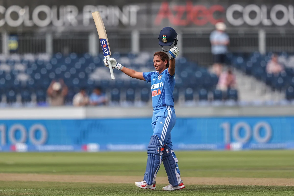 Harmanpreet Kaur celebrates after scoring a century.