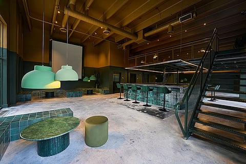 Cafeina’s reimagined interior blends sculptural design, rich green tones, and a multi-level layout for elevated events