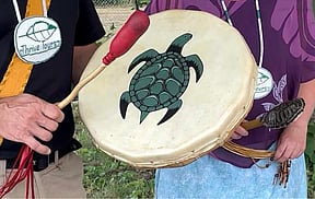Drumming with Thrive Tours at Garden River Pow Wow. PHOTO BY ADAM WAXMAN/DINE AND DESTINATIONS MAGAZINE