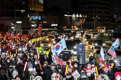 Marcha em Seul contra a destituição de Han Duck-soo.