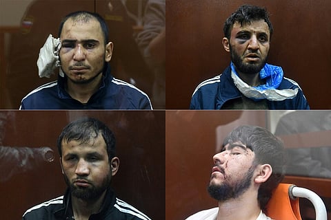 Os suspeitos do ataque terrorista apareceram em tribunal com marcas visíveis de maus-tratos. TATYANA MAKEYEVA e OLGA MALTSEVA / AFP