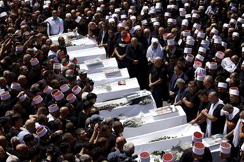Funeral de dez dos 12 menores que morreram no ataque de sábado.