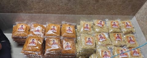 Food packets carrying the photo of cricketer Ravindra Jadeja's wife, Rivaba. Photo: Himanshu Bhayani