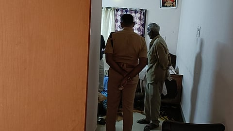 Police inspect the Srirangam Yatri Nivas room where bodies were found on Friday
