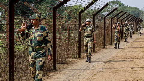 Border Security Force (BSF) personnel patrol along the India-Bangladesh border, on the outskirts of Agartala, Tripura, Saturday, Dec. 20, 2025. 