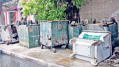 Damaged dustbins blocking the footpath on Pantheon Road.