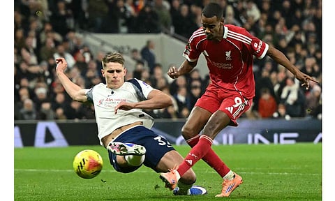 Alexander Isak scores before being injured in a challenge by Micky van de Ven 