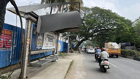 The Gandhi Nagar bus shelter, with a ripped-off roof, has exposed commuters to vagaries of the weather