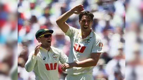 Australia's Pat Cummins celebrates with teammates