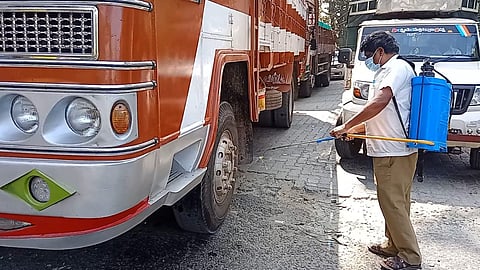 Officials spraying disinfectants on vehicles at checkposts bordering Kerala

